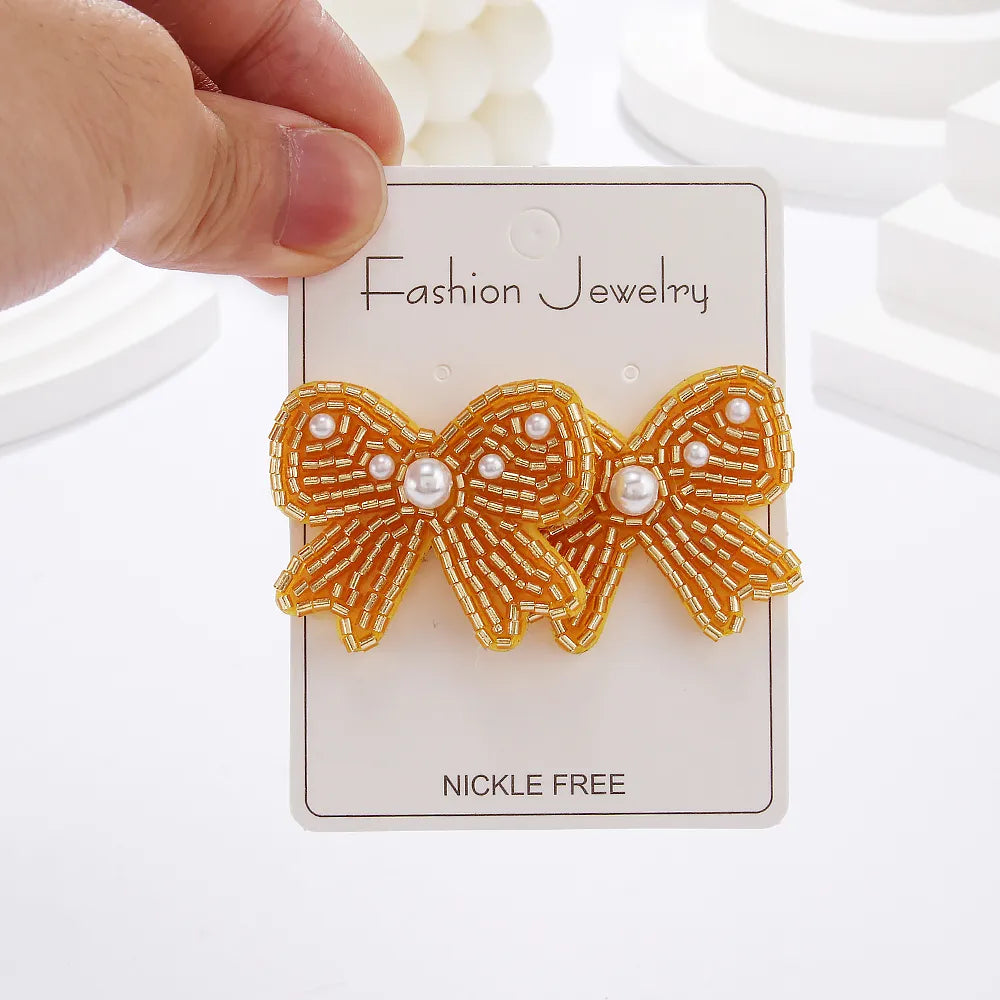 1 Pair Casual Elegant Simple Style Bow Knot Inlay Beaded Seed Bead Artificial Pearls Ear Studs