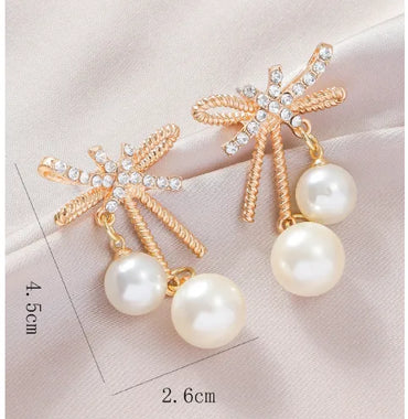 1 Pair Elegant Streetwear Bow Knot Inlay Alloy Artificial Pearls Gold Plated Drop Earrings