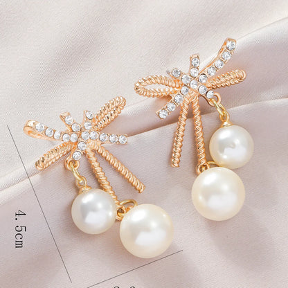 1 Pair Elegant Streetwear Bow Knot Inlay Alloy Artificial Pearls Gold Plated Drop Earrings