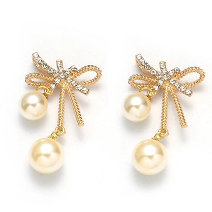 1 Pair Elegant Streetwear Bow Knot Inlay Alloy Artificial Pearls Gold Plated Drop Earrings