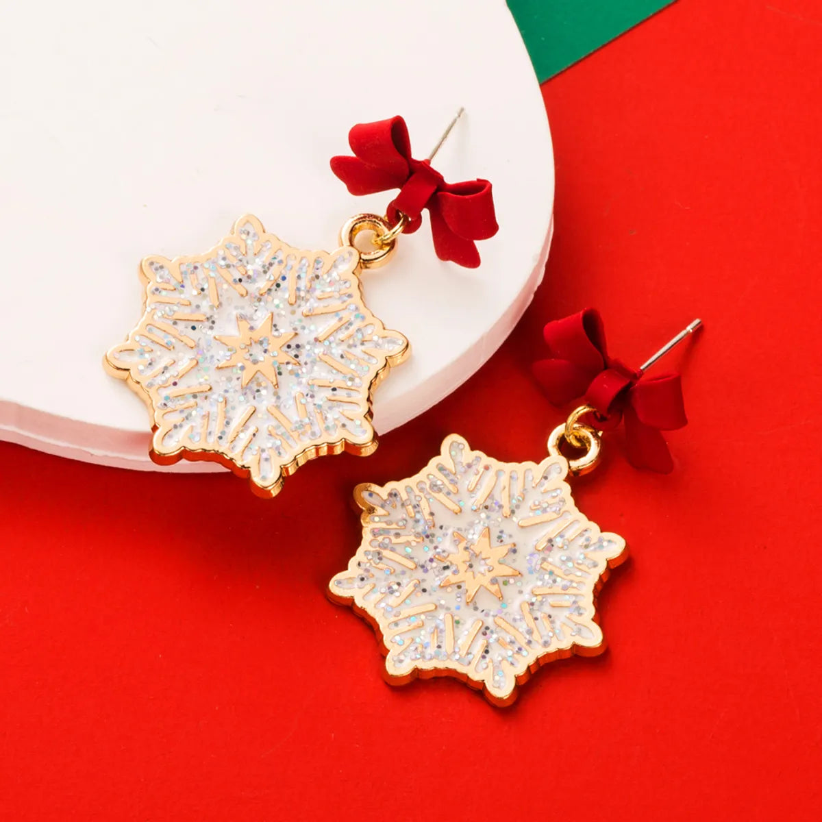 1 Pair Elegant Streetwear Bow Knot Snowflake Enamel Alloy Gold Plated Drop Earrings