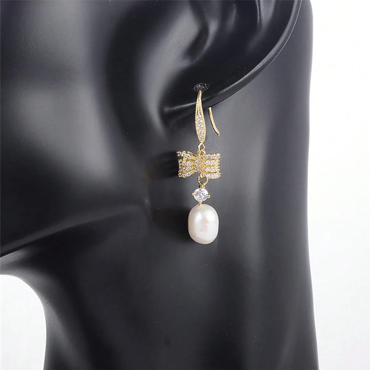 1 Pair Elegant Vacation Shiny Irregular Bow Knot Plating Inlay Copper Freshwater Pearl Zircon Drop Earrings