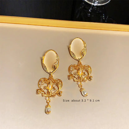 1 Pair Glam Retro Devil'S Eye Flower Inlay Alloy Artificial Pearls Rhinestones Drop Earrings