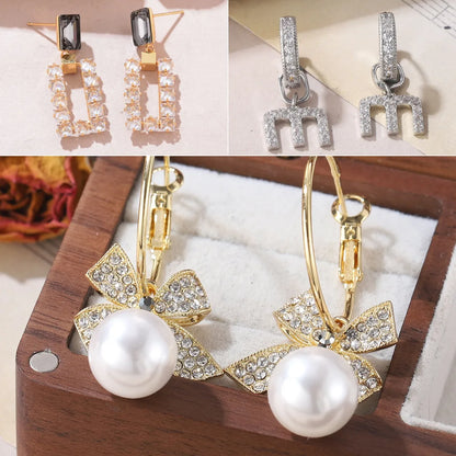 1 Pair Lady Vacation Streetwear Letter Bow Knot Inlay Copper Imitation Pearl Rhinestones Zircon 18K Gold Plated Drop Earrings