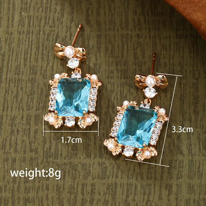 1 Pair Retro Xuping Geometric Bow Knot Plating Inlay Alloy Copper Alloy Artificial Gemstones Artificial Pearls 18k Gold Plated Drop Earrings