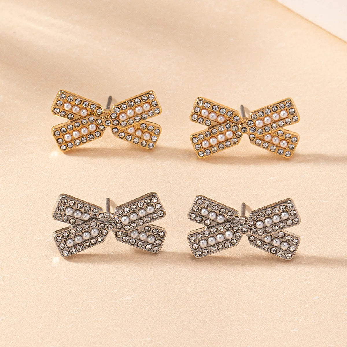 1 Pair Simple Style Classic Style Commute Bow Knot Inlay Plastic Zinc Alloy Artificial Pearls Rhinestones Ear Studs