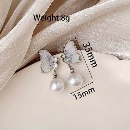 1 Pair Simple Style Classic Style Wings Plating Inlay Alloy Artificial Rhinestones Artificial Pearls White Gold Plated Drop Earrings