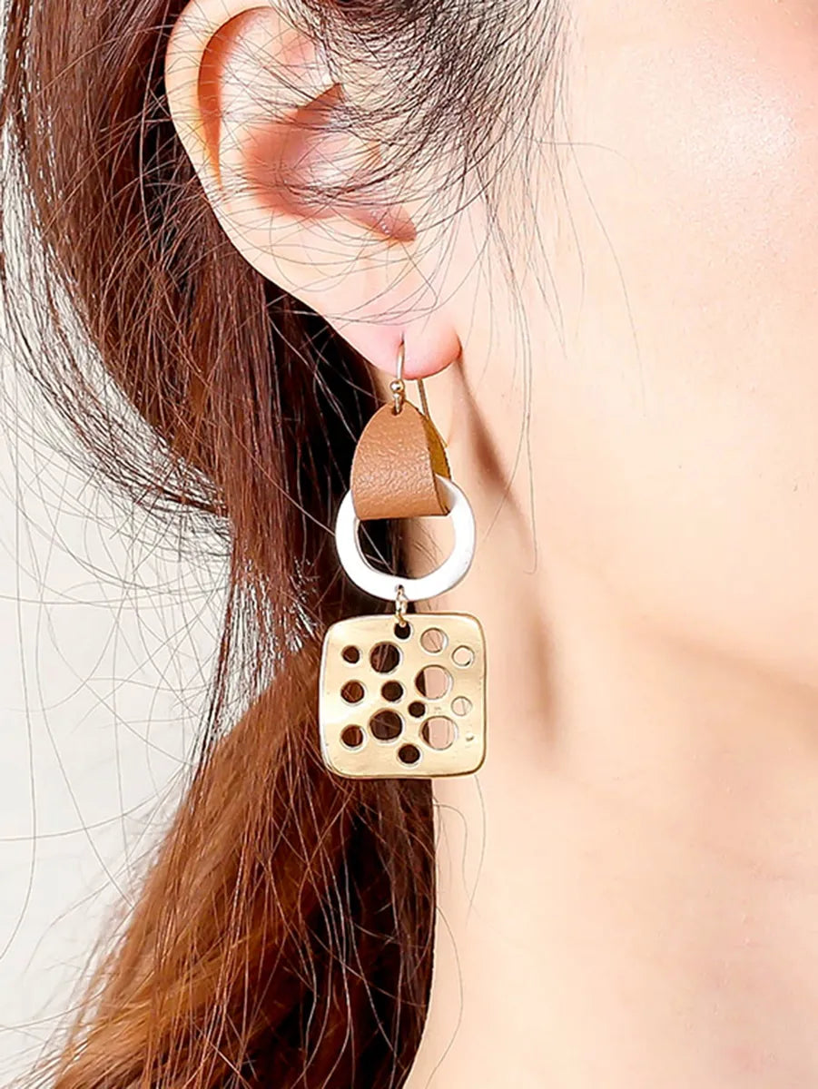 1 Pair Simple Style Commute Color Block Irregular Hollow Out Pu Leather Drop Earrings