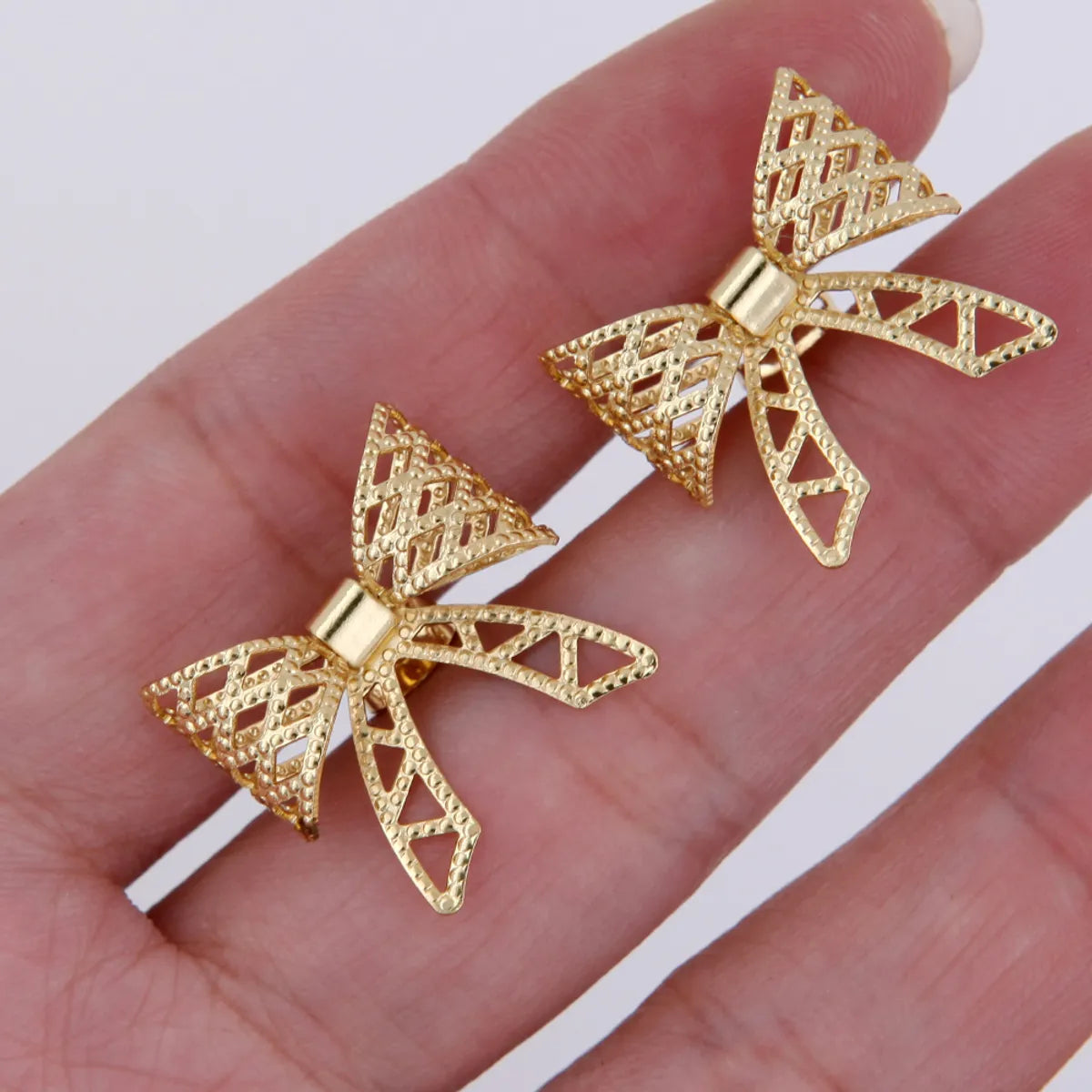 1 Pair Sweet Simple Style Solid Color Bow Knot Plating Hollow Out Copper 18K Gold Plated White Gold Plated Ear Studs