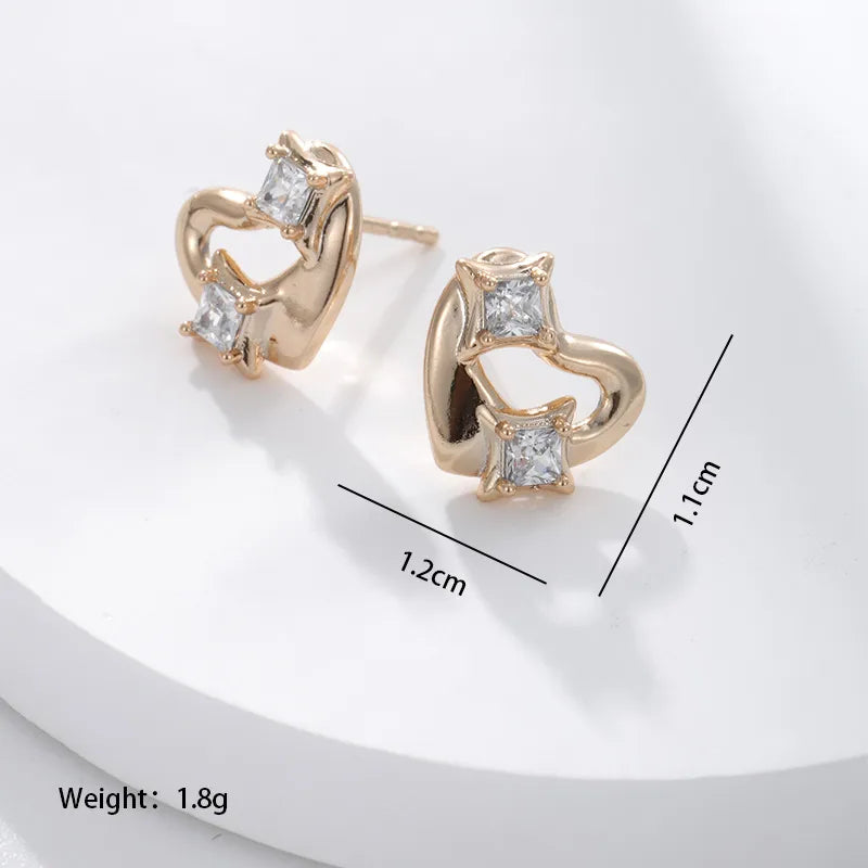 1 Pair Xuping Simple Style Heart Shape Plating Inlay Alloy Copper Alloy Artificial Gemstones 18k Gold Plated Ear Studs