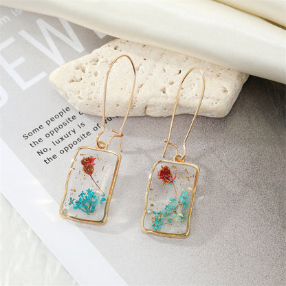 Simple Style Flower Synthetic Resin Alloy Epoxy Transparent Women's Dangling Earrings 1 Pair