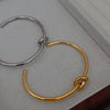 Fashion Solid Color Titanium Steel Plating Knot Bangle