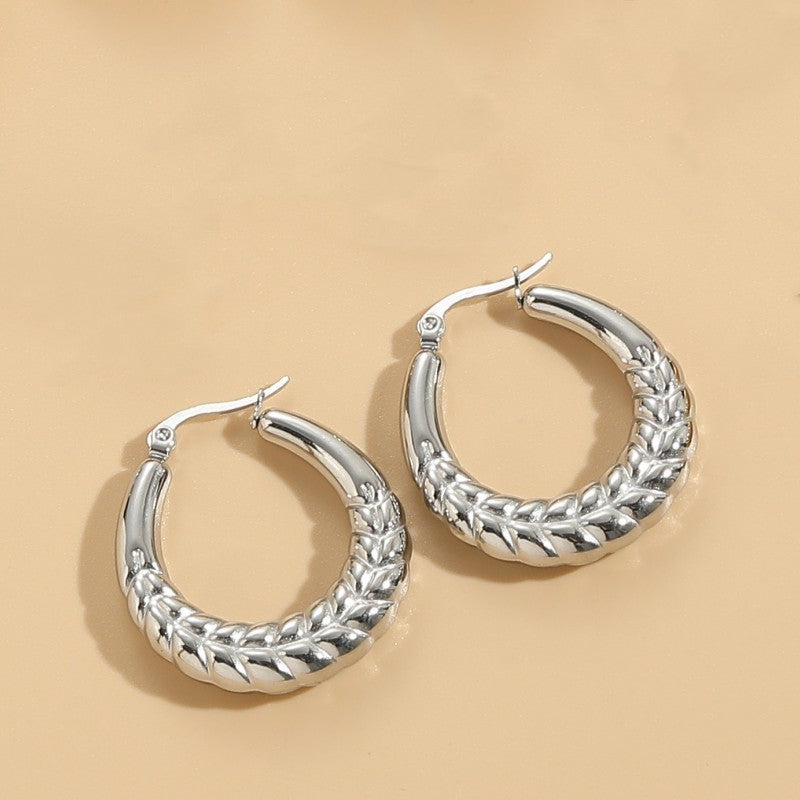 1 Pair Elegant Classic Style Stripe Oval Twist Hollow Out Titanium Steel Earrings