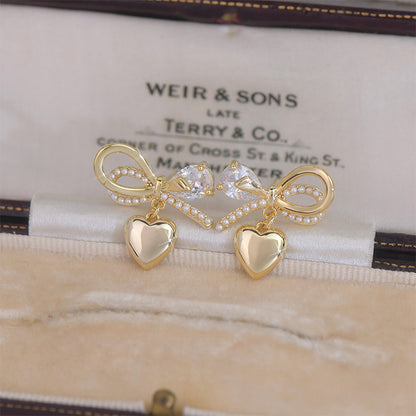 1 Pair Fairy Style French Style Simple Style Heart Shape Bow Knot Plating Inlay Copper Artificial Pearls Zircon 14k Gold Plated Ear Studs