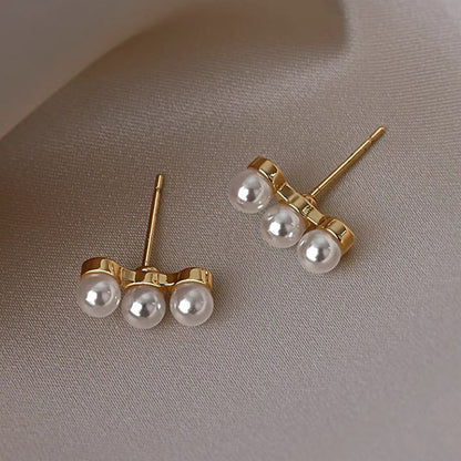 1 Pair Elegant Simple Style Streetwear Flower Bow Knot Plating Inlay Alloy Artificial Pearls Zircon Ear Studs