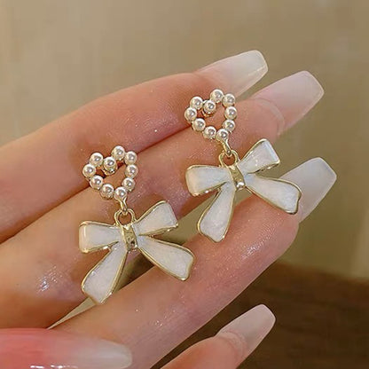 1 Pair Elegant Simple Style Streetwear Flower Bow Knot Plating Inlay Alloy Artificial Pearls Zircon Ear Studs