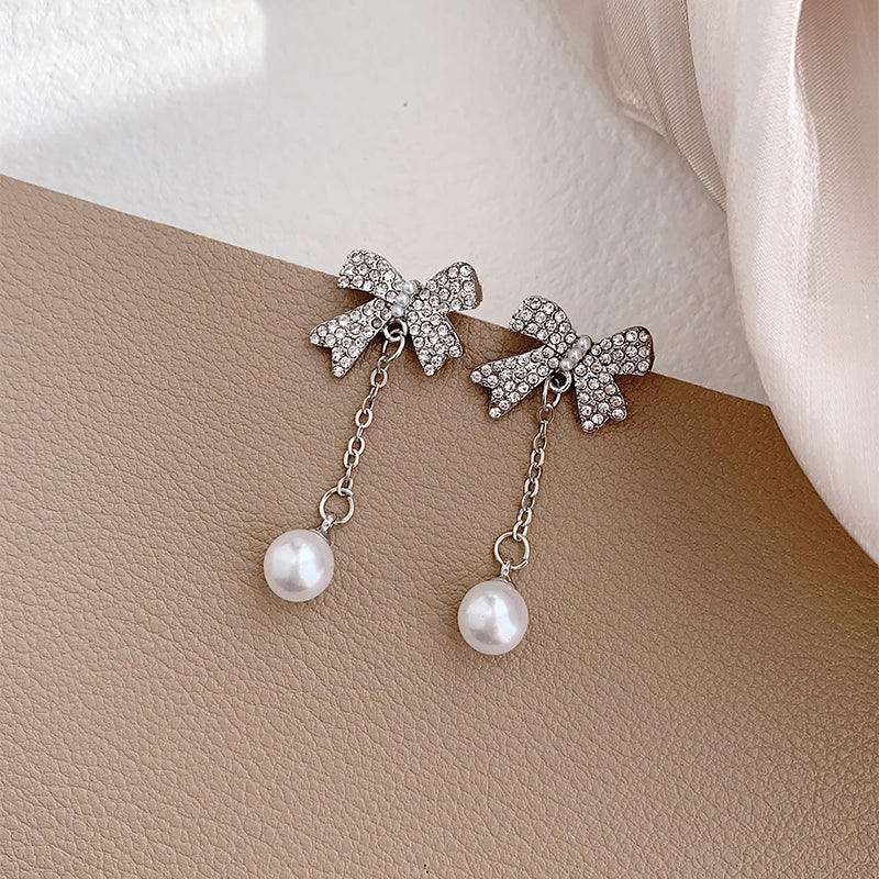 1 Pair Elegant Romantic Bow Knot Plating Inlay Alloy Artificial Rhinestones Artificial Pearls White Gold Plated Drop Earrings