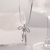 Wholesale Jewelry Simple Style Classic Style Bow Knot Titanium Steel Gold Plated Plating Pendant Necklace