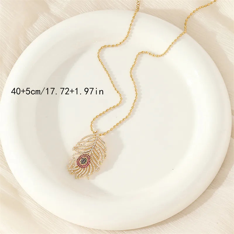 201 Stainless Steel Brass 18K Gold Plated Simple Style Classic Style Inlay Devil'S Eye Heart Shape Feather Zircon Pendant Necklace