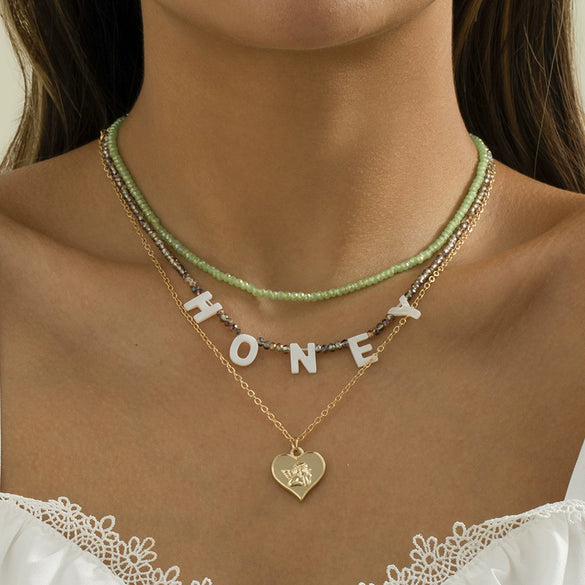Alloy Bead Letter Stacked Heartshaped Pendant Collarbone Necklace For Women With Geometric Pattern And Electroplating Treatment