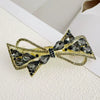 Alloy Crystal Spring Hairpin For Women With Bow Design And Electroplating Processing