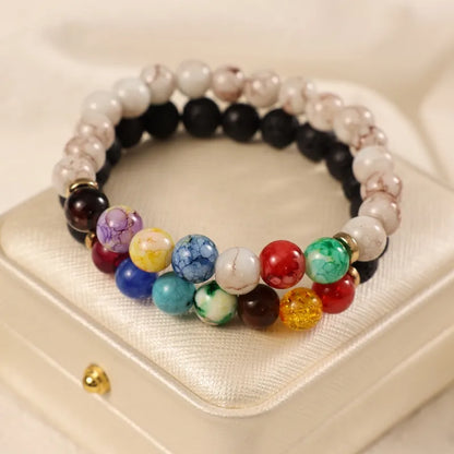 Basic Ethnic Style Modern Style Round Crown Arylic Volcanic Rock Glass Beaded Unisex Bracelets