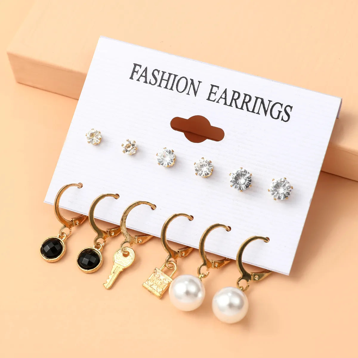 Basic Simple Style Heart Shape Spiral Stripe Leopard Arylic Imitation Pearl Alloy Inlay Rhinestones Women'S Earrings