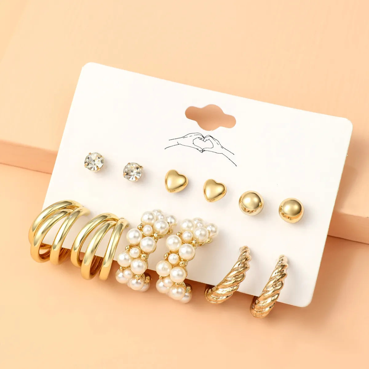 Basic Simple Style Heart Shape Spiral Stripe Leopard Arylic Imitation Pearl Alloy Inlay Rhinestones Women'S Earrings