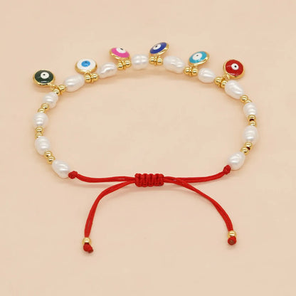 Bohemian Devil's Eye Flower Imitation Pearl Alloy Wholesale Bracelets