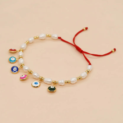 Bohemian Devil's Eye Flower Imitation Pearl Alloy Wholesale Bracelets