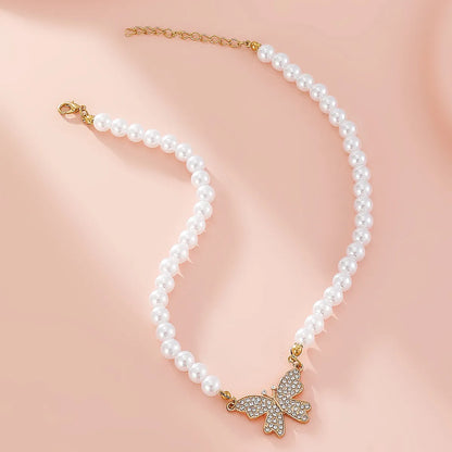 Casual Elegant Butterfly Imitation Pearl Alloy Beaded Inlay Rhinestones Women'S Pendant Necklace