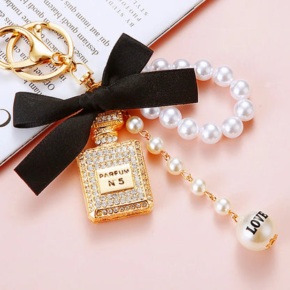 Cute Letter Bow Knot Perfume Bottle Metal Women'S Keychain