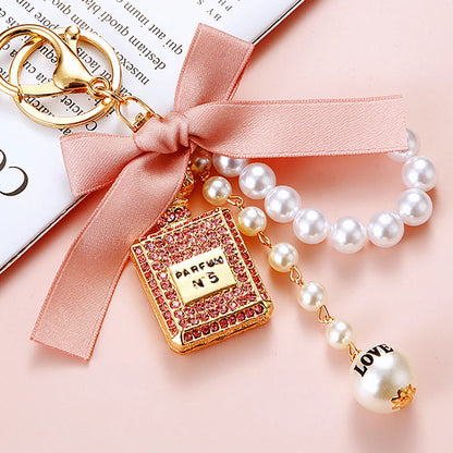 Cute Letter Bow Knot Perfume Bottle Metal Women'S Keychain