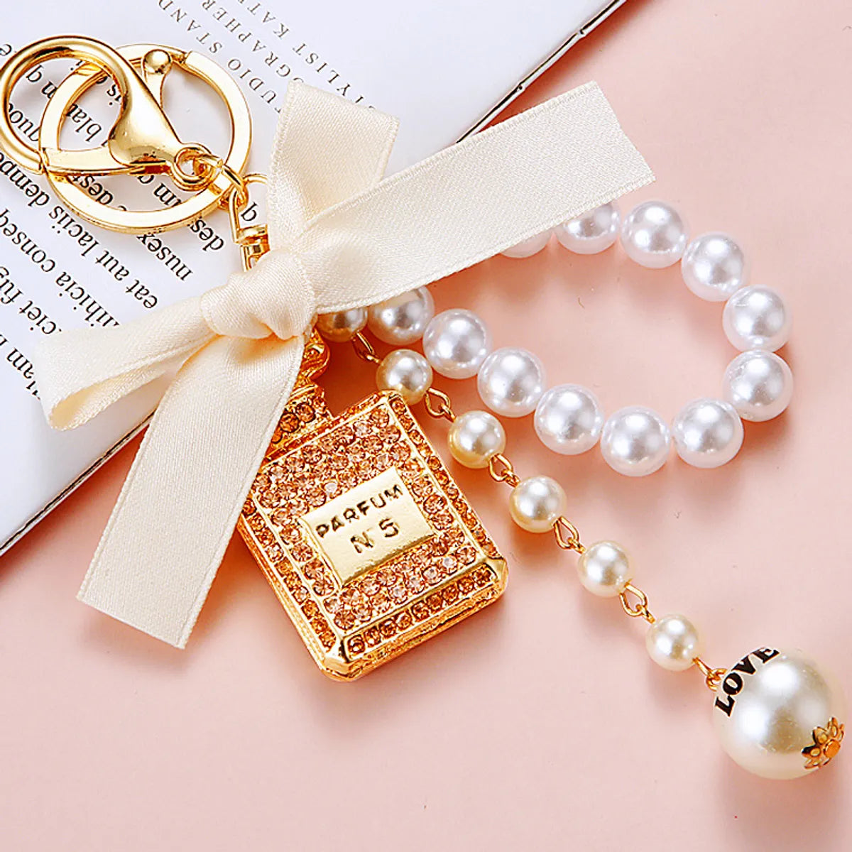 Cute Letter Bow Knot Perfume Bottle Metal Women'S Keychain