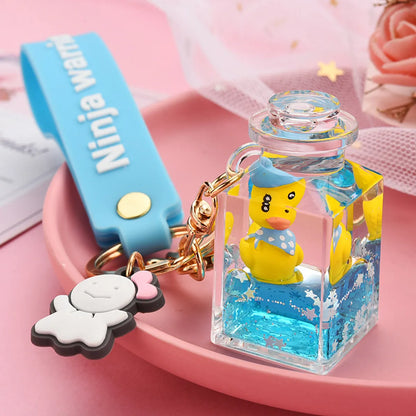 Cute Quicksand Little Yellow Duck Dinosaur Perfume Bottle Acrylic Keychain Wholesale Nihaojewelry