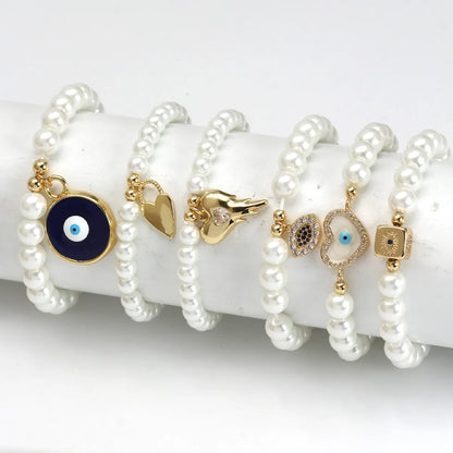 Elegant Devil'S Eye Heart Shape Artificial Pearl Glass Copper Wholesale Bracelets