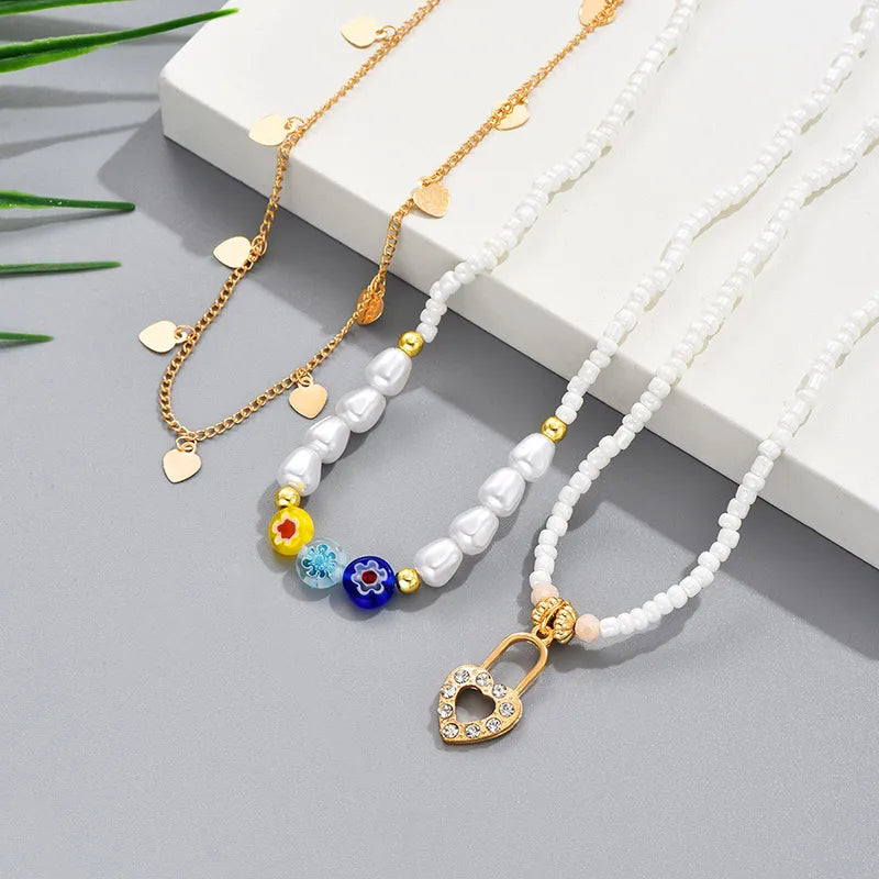 Elegant Geometric Heart Shape Flower Alloy Glass Plating Women'S Pendant Necklace