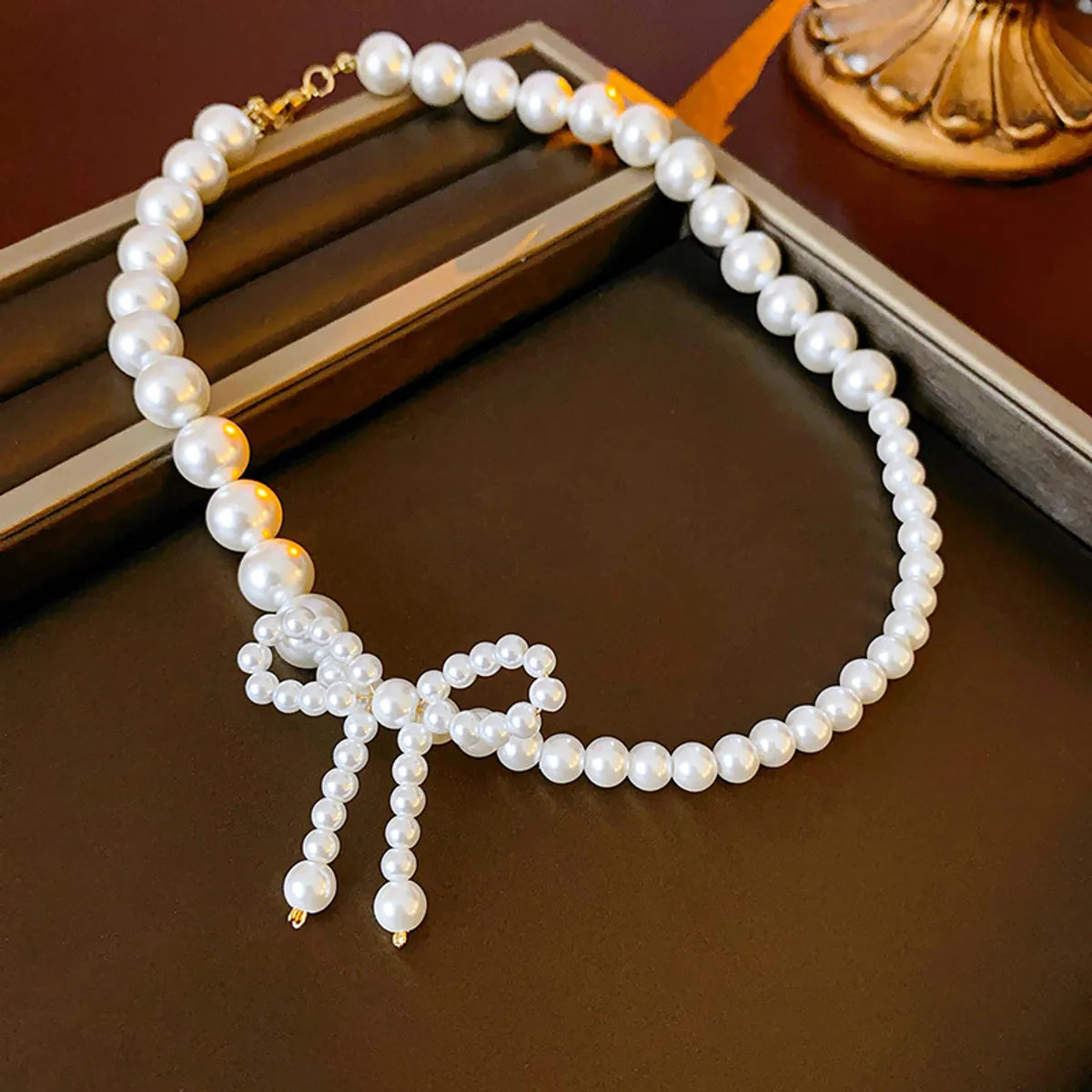 Elegant Heart Shape Flower Bow Knot Imitation Pearl Metal Beaded Inlay Rhinestones Women'S Necklace