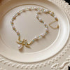 Elegant Heart Shape Flower Bow Knot Imitation Pearl Metal Beaded Inlay Rhinestones Women'S Necklace