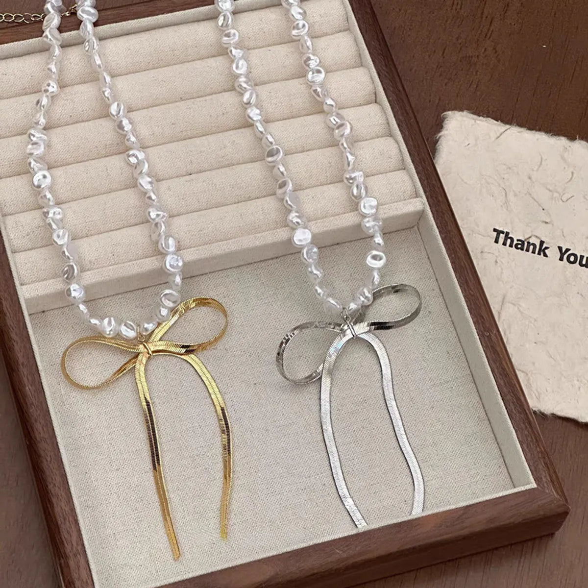 Elegant Lady Bow Knot Imitation Pearl Titanium Steel Wholesale Pendant Necklace