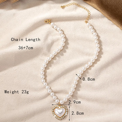 Elegant Lady Heart Shape Arylic Alloy Beaded Plating Inlay Artificial Gemstones Artificial Rhinestones 14k Gold Plated Women'S Pendant Necklace