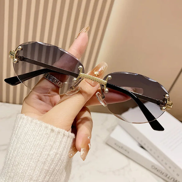Elegant Simple Style Solid Color Pc Tinted Lenses Oval Frame Frameless Women'S Sunglasses