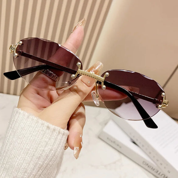 Elegant Simple Style Solid Color Pc Tinted Lenses Oval Frame Frameless Women'S Sunglasses