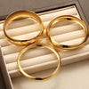 Exaggerated Widefaced Closedmouth Plain Ring And Gold Bracelet Threepiece Set Of Jewelry In Alloy With Electroplating