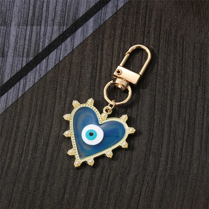 Fashion Devil'S Eye Heart Shape Arylic Alloy Bag Pendant Keychain