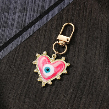 Fashion Devil'S Eye Heart Shape Arylic Alloy Bag Pendant Keychain