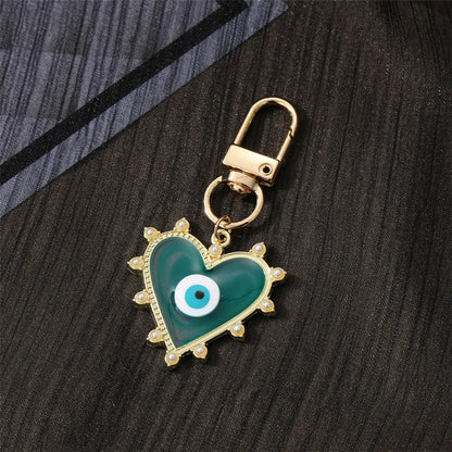 Fashion Devil'S Eye Heart Shape Arylic Alloy Bag Pendant Keychain