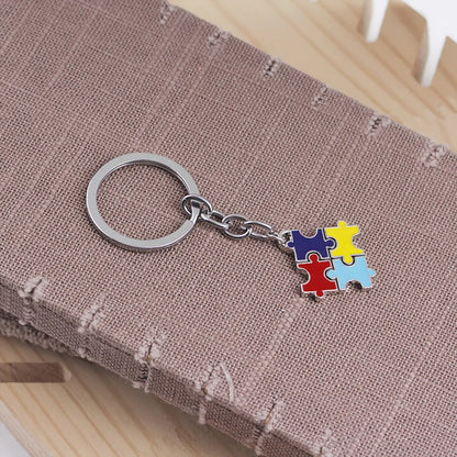 Fashion Explosion Key Chain Children'S Four-Color Puzzle Drip Oil Key Chain Small Pendant Jewelry Wholesale Nihaojewelry