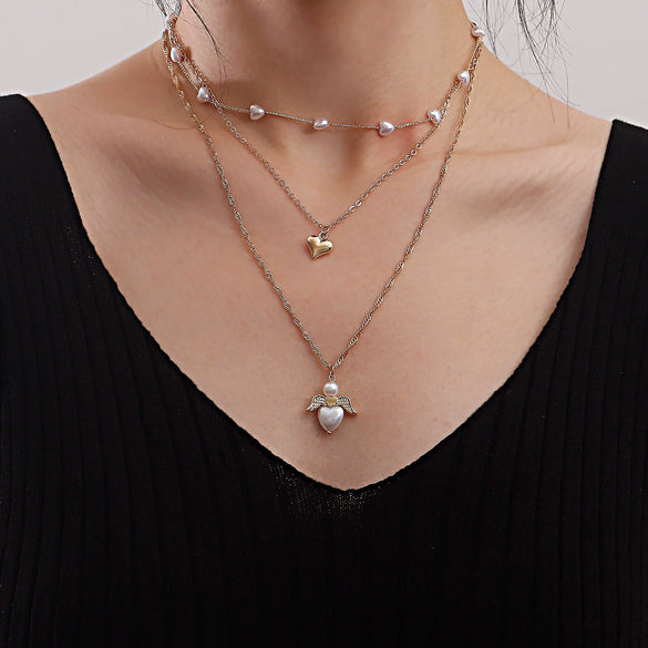 Fashion Multilayer Heartshaped Pearl Angel Wings Alloy Necklace For Female With Electroplating Treatment