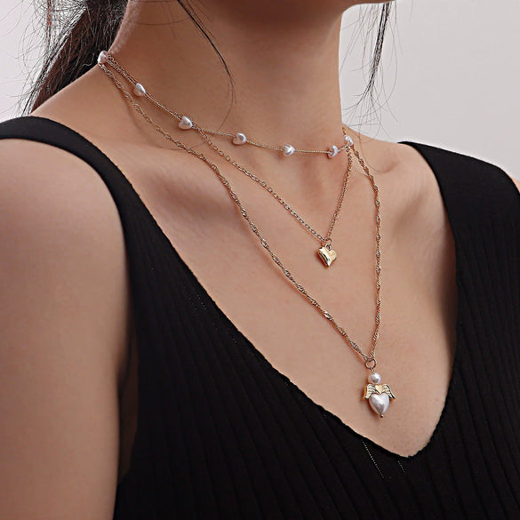 Fashion Multilayer Heartshaped Pearl Angel Wings Alloy Necklace For Female With Electroplating Treatment